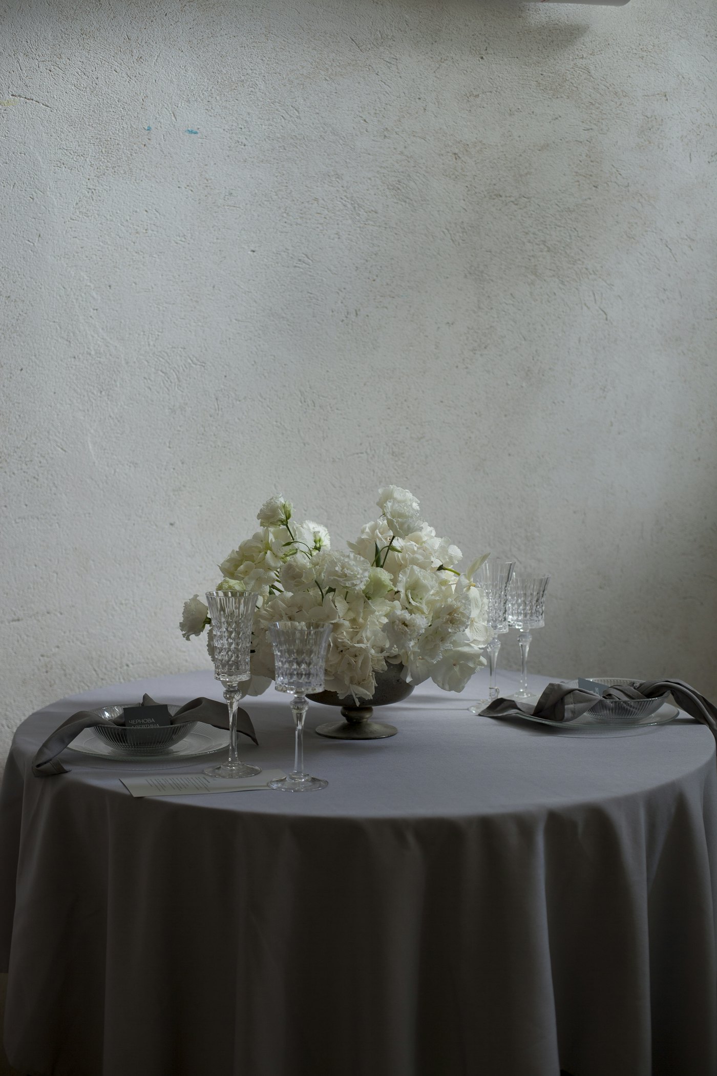 White roses on a dark tablecloth
