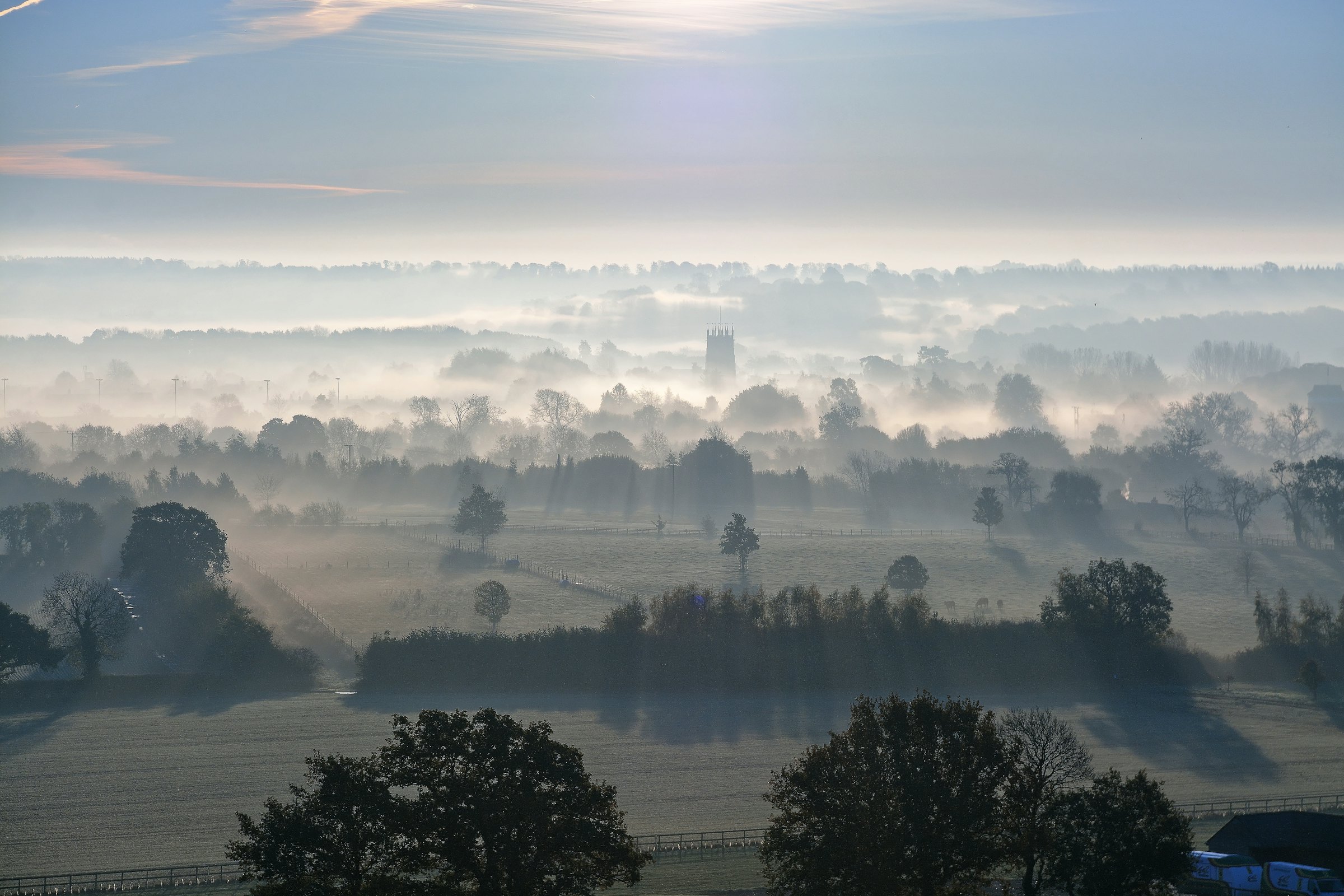 Mist lying across the Surrey countryside at dawn