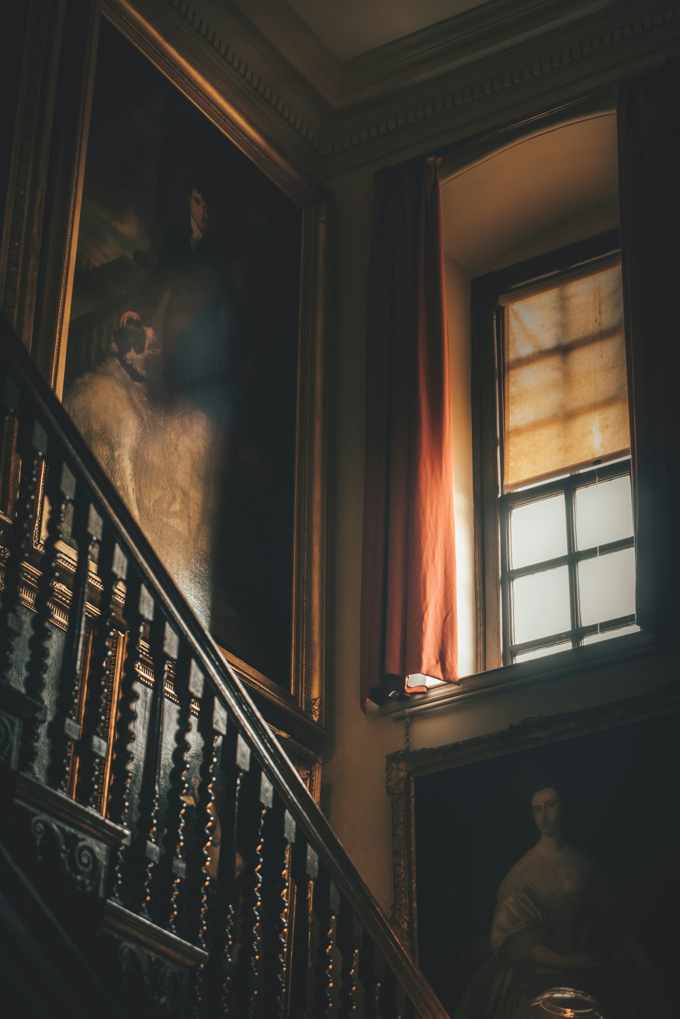 Late light falling across a wood-panelled staircase
